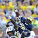 Michigan defensive tackle Quinton Washington attempts to get a hand on the ball in the fourth quarter at Michigan Stadium on Saturday. Melanie Maxwell I AnnArbor.com